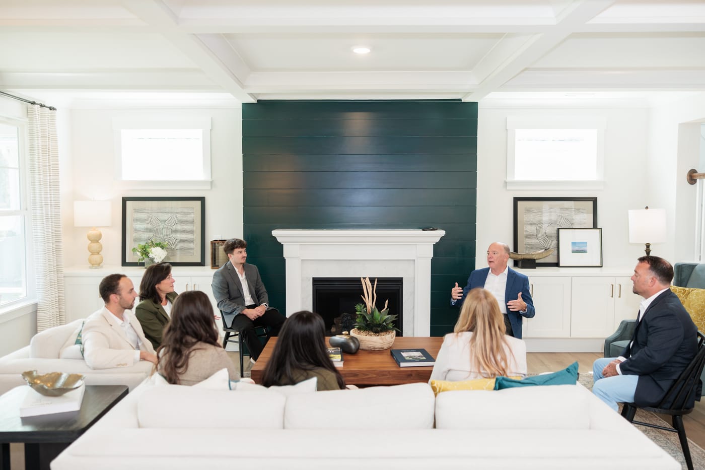 Buddy leading the team huddle by the fireplace